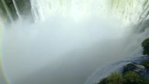 Aerial reveal of massive waterfall drop at Garganta del Diablo with dense mist Stock Footage 328912705