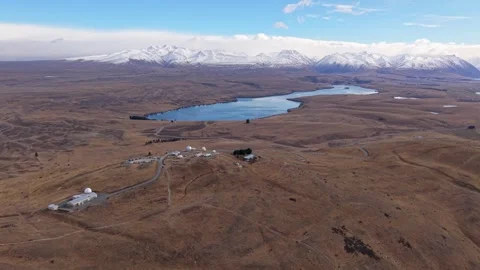 Aerial Reveal of Mount John Observatory and Lakes in Tekapo, New Zealand Stock Footage 346922178