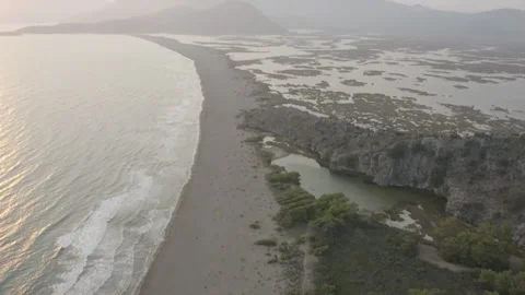 An aerial reveal of the protected turtle nesting beach Istuzu in Turkey Stock Footage 232795364