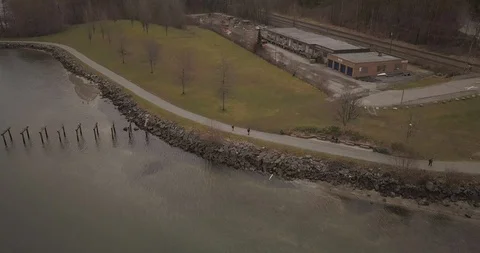 Aerial reveal shot of a structure in a local park Stock Footage 89986994