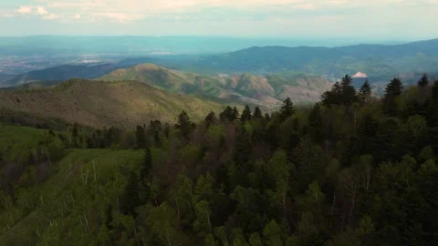 Aerial reveal shot tracking left over green mountain range wide panorama Serbia Stock Footage 342240960