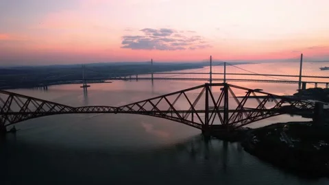 Aerial Revealing Firth of Forth Three Bridges at Sunset Stock Footage 172544040
