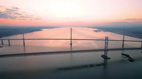 Aerial Revealing Forth Road Bridge and Queensferry Crossing During Sunset Stock Footage 172549765