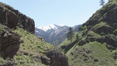 Aerial revealing over cliffs of Hells Canyon to Seven Devils mountains Stock Footage 203912088