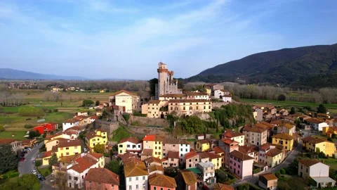Aerial reverse drone view Nozzano Castle flight Lucca Tuscany Italy Stock-Footage 184563222