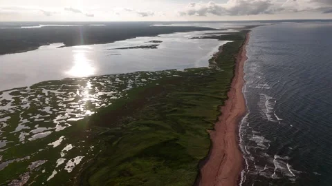 Aerial Reverse Flight Over Marsh and Sandbar with Sun Flare, PEI 스톡 동영상 341363463