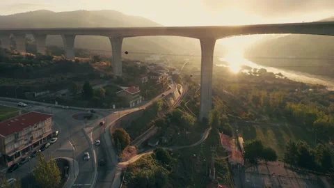 Aerial reverse over 3 bridges during a foggy sunrise, with speed ramp Stock Footage 142789991