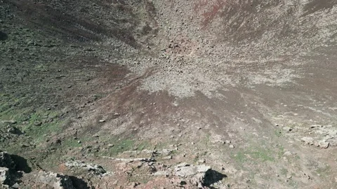 Aerial reverse reveal clip of the dramatic Volcan Calderon Hondo volcano Stock Footage 227763076