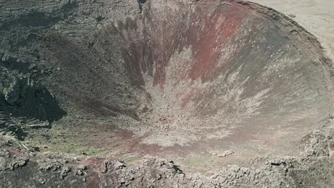 Aerial reverse reveal clip of the dramatic Volcan Calderon Hondo volcano Stock Footage 227769275