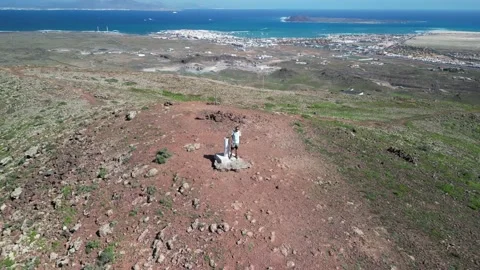 Aerial reverse reveal clip at the summit of Volcan de Bayuyo volcano Corralejo Stock Footage 227761823