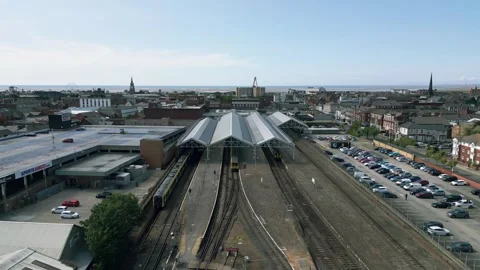 Aerial reverse reveal clip of the train and railway station Stock Footage 244813537