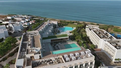 Aerial reverse view over Hotels and Apartment buildings with Mediterranean sea Stock-Footage 340416336