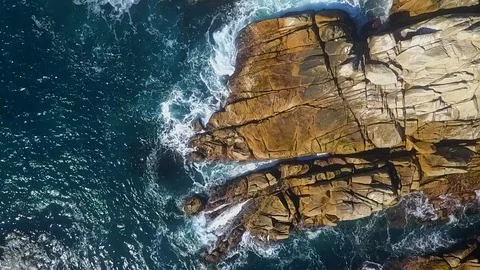 Aerial of Rip Tides and Waves Crashing on Rocks Stock Footage 101215795