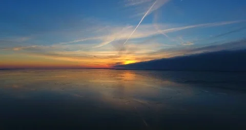 Aerial, rise up over the ice covered lagoon Stock-Footage 101551925