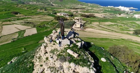 Aerial of Risen Christ statue at atop of hill in Gozo Stock Footage 94926746