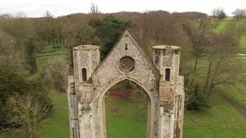 Aerial rising over the circular window of the remaining East wall and window of Vídeos de archivo 144754260