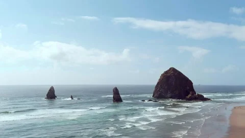Aerial rising shot of Haystack Rock at Cannon Beach on the Oregon coast. Stock Footage 311582017