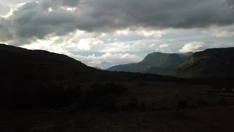 Aerial Rising Through Dramatic Scottish Landscape To Reveal Loch In Mountains Stock-Footage 125186668