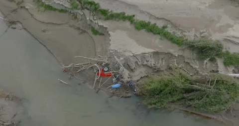 Aerial: River and dead trees washed down in flood from cyclone. New Zealand Stock Footage 244112653