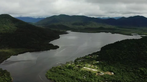 Aerial of River and Riverside Community in Rainforest 库存影片 340535005