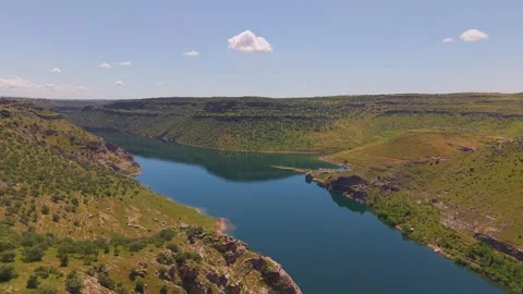 Aerial River Bend Through Dramatic Canyon Landscape Toward the Opposite Shore Stock Footage 340999893