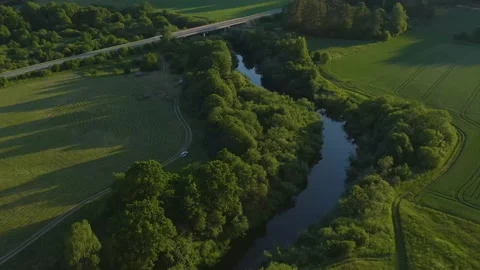 Aerial River with Bridge At Evening in Lithuania Stock Footage 132830189