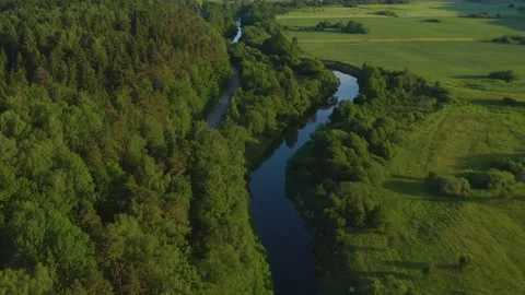 Aerial River in Fields At Evening in Lithuania Stock Footage 132830145