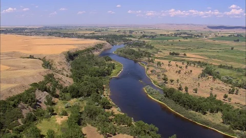 Aerial of river flowing through dense forest trees, Yellowtail Dam Stock Footage 109465145