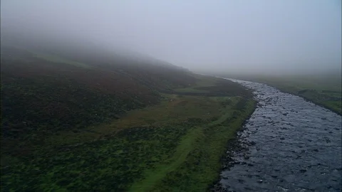 Aerial of river flowing through the green mountain, Turneresque Misty River Tess Stock Footage 108599232
