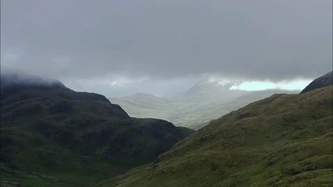 Aerial of river flowing through the mountain ranges, Around Loch Etive Area Stock Footage 108584029
