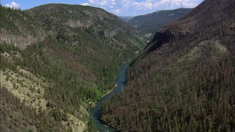 Aerial of river flowing through mountain cliff, Winding river in wooded mountain Stock Footage 109465725