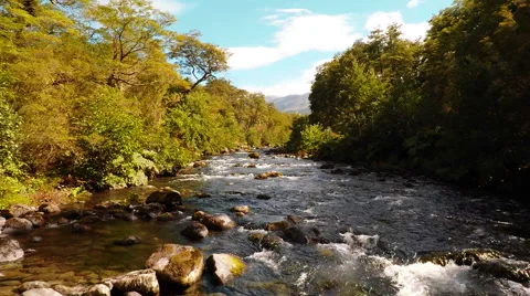 Aerial: River Low Angle Flying Past Kayakers In Forrest In Patagonia Chile 2K Stock Footage 64673612