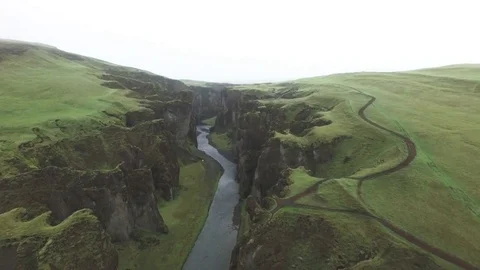 Aerial of river passing through beautiful green mountains Stock Footage 69741124