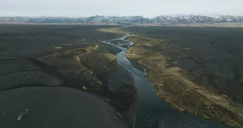 Aerial of river running though the land in Iceland Stock Footage 228653103