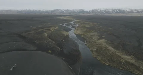 Aerial of river running though the land in Iceland Stock Footage 228655530