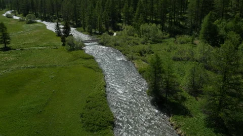 Aerial of a river running through a green forest Stock Footage 64343386
