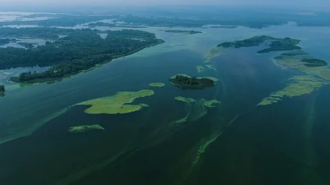 Aerial of river with small islands infested with blue green algae Stock-Footage 103846233