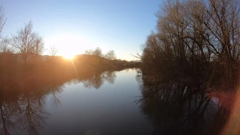 AERIAL River at sunset Stock Footage 101076379