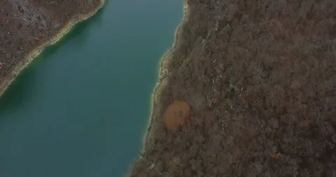 Aerial of river through green mountain forest Stock Footage 89977926