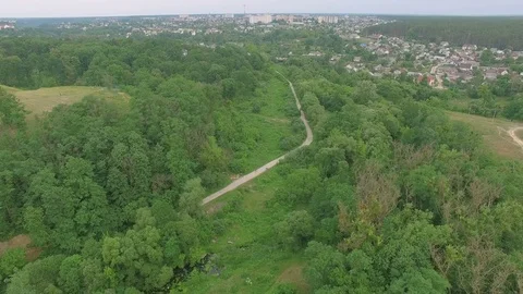 Aerial road along the river above electric pillars Stock Footage