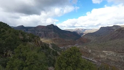 Aerial of road switchbacks through a scenic canyon Stock Footage 71880070
