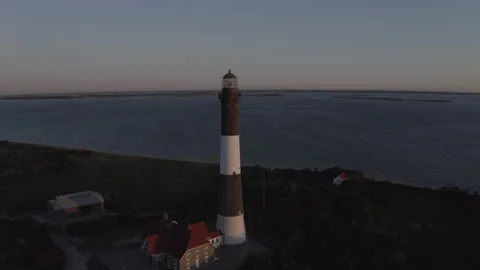 Aerial Robert Moses Lighthouse Half Orbit Reveal Sunrise 4K@24FPS DLOG Video stock 297023198