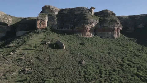 Aerial to rock cliff formation called Camel Rock in South Africa Stock Footage 226125187