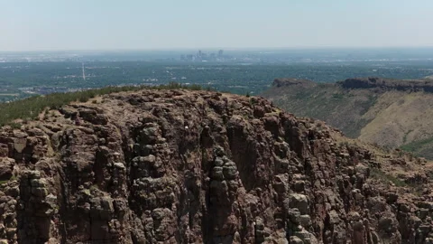 Aerial of rock climber on Table Mountain in Golden Colorado Denver city view Video stock 337130756