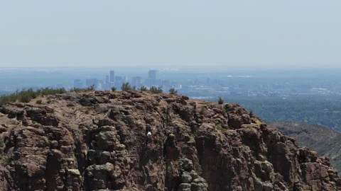 Aerial of rock climber on Table Mountain in Golden Colorado with Denver view Video stock 337131175