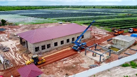 Aerial rocket pull away view of operating crane vehicle and engineer at 스톡 동영상 298033478
