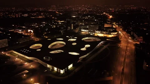 Aerial: Rolex Learning Center and EPFL campus at night in Lausanne, Switzerland Stock Footage 325845299