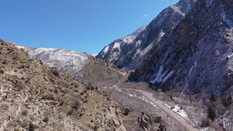 Aerial roll over winter road in Millcreek Canyon, Utah Stock Footage 333885008
