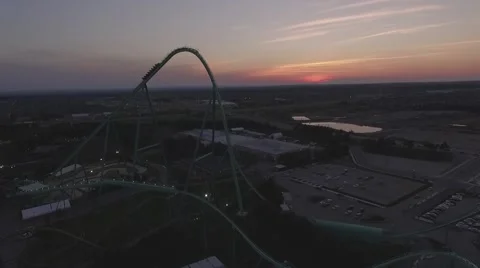 Aerial roller coaster in action during sunset Stock Footage 60131718