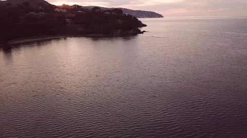 Aerial romantic view of a sunset along the sea coast of Tuscany Video stock 104491027